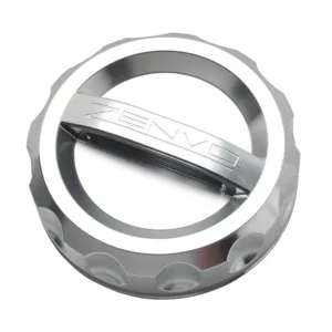 A high-precision CNC-machined aluminum fuel cap with Zenvo branding.