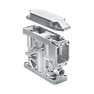 A complex CNC-machined aluminum housing with a removable cover.